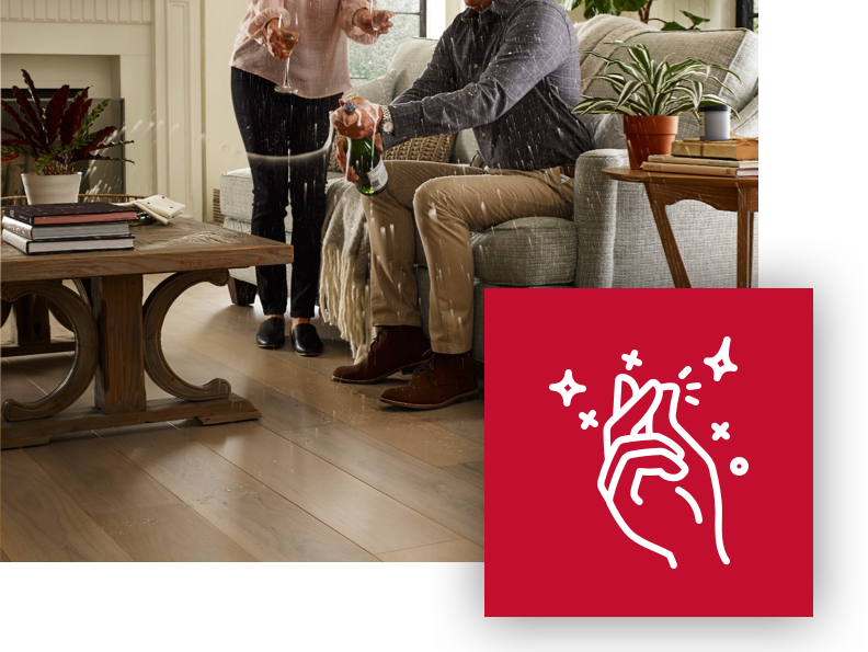 Couple spilling champagne on a durable Floorte floor | Floor Systems in Lisbon, ME