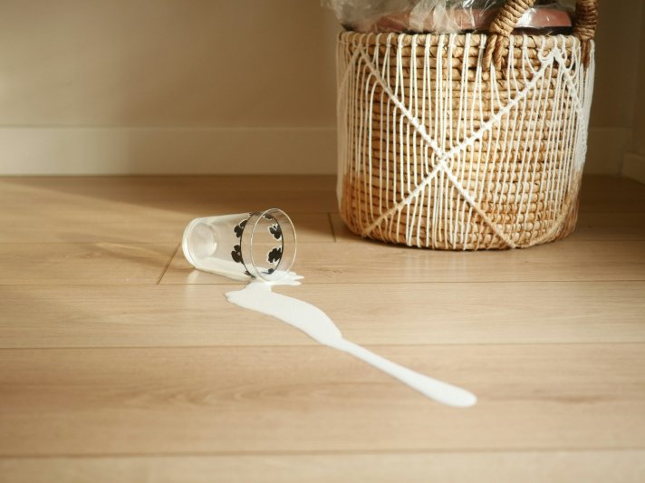 Laminate floor with a spilled glass of milk | Floor Systems in Lisbon, ME