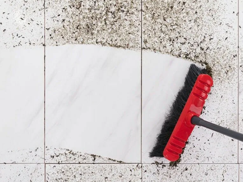 Sweeping dirt on a tile floor | Floor Systems in Lisbon, ME