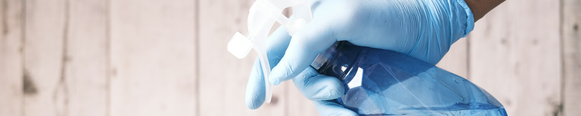 Spraying cleaner on a hardwood surface | Floor Systems in Lisbon, ME